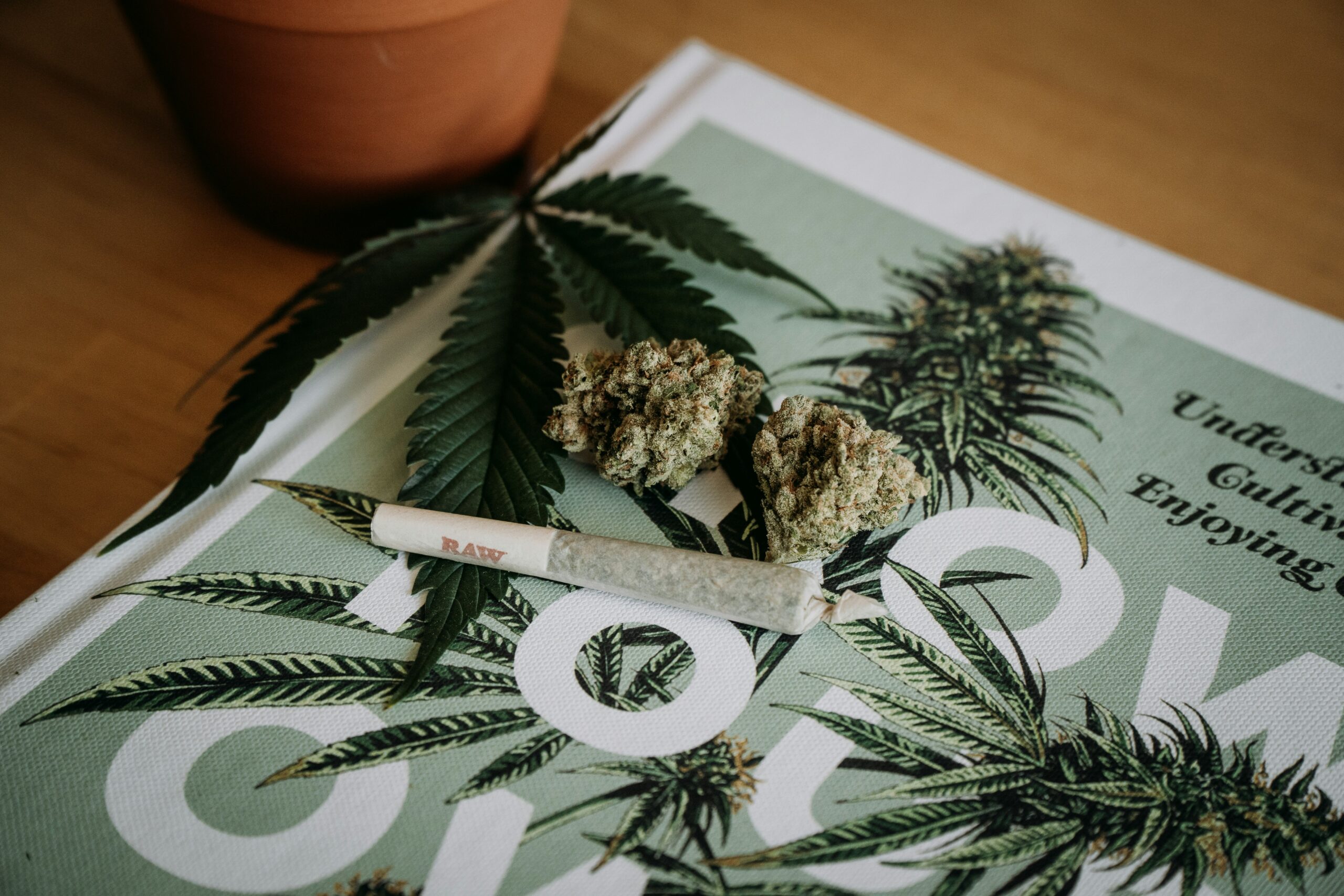 A Cannabis Spliff on a magazine rolled in RAW rolling paper